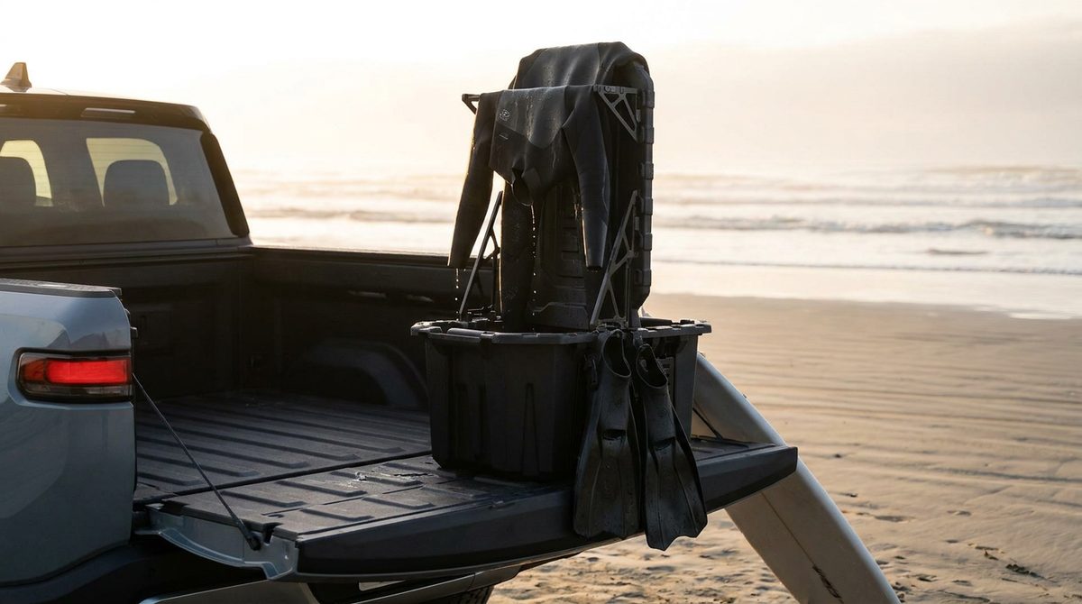 GRBX bin on a truck tailgate at the beach at sunset with a wetsuit and fins drying